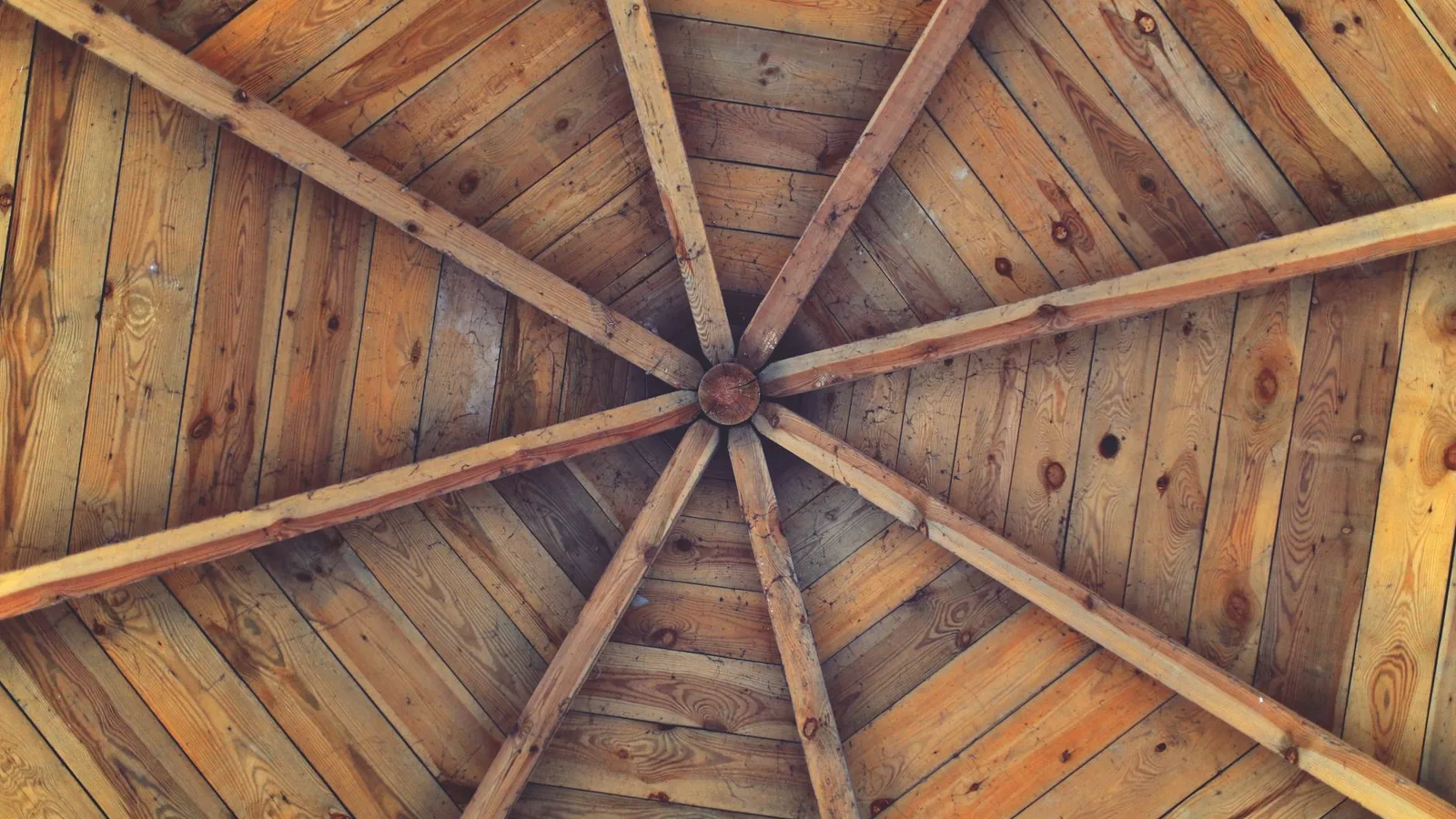 Exposed wood roof underside and framing viewed from below