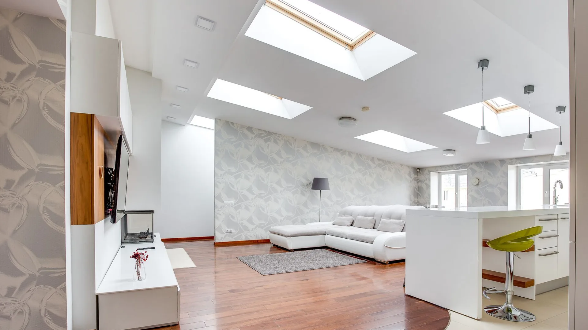 Bright living space with several skylights installed through the ceiling
