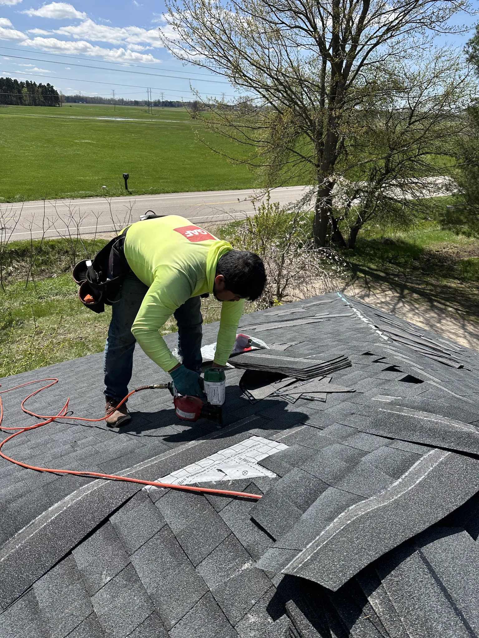 Platinum Roofing crew installing shingles on residential roof